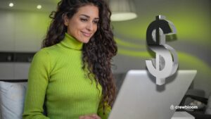 Offshore remote staff working on her laptop with a dollar sign overlay symbolizing cost savings.