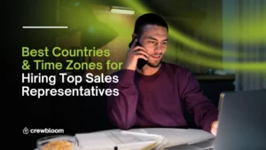 Remote professional working on a laptop at home with the blog title “Best Countries & Time Zones for Hiring Sales Representatives” overlay on the image